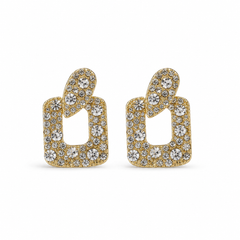 A pair of gold geometric stud earrings paved with clear round gemstones, displayed on a clean white background.