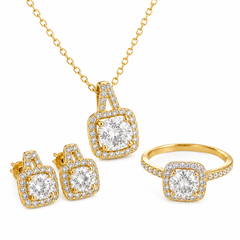 Gold jewelry set featuring a pendant necklace, matching stud earrings, and a ring, each with a square cushion-cut clear gemstone surrounded by small pavé stones on a white background.