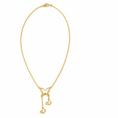 A delicate gold chain necklace featuring a butterfly-shaped pendant with two dangling key charms, displayed on a clean white background.