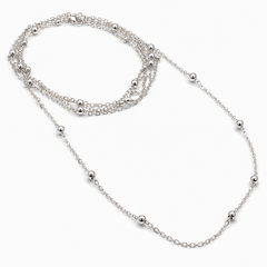 A multi-strand silver chain necklace with small polished bead accents, displayed on a clean white background.