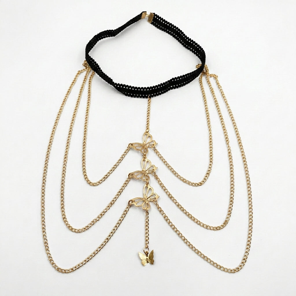 A gold-tone layered chain necklace with butterfly charms and a black beaded collar band, displayed on a clean white background.