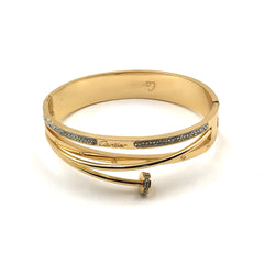 A gold bangle bracelet with a wrap-around design, featuring two inlaid rows of small clear stones on the front. The inside of the band is engraved with the Cartier logo, and a small round bezel-set stone sits at the front clasp.